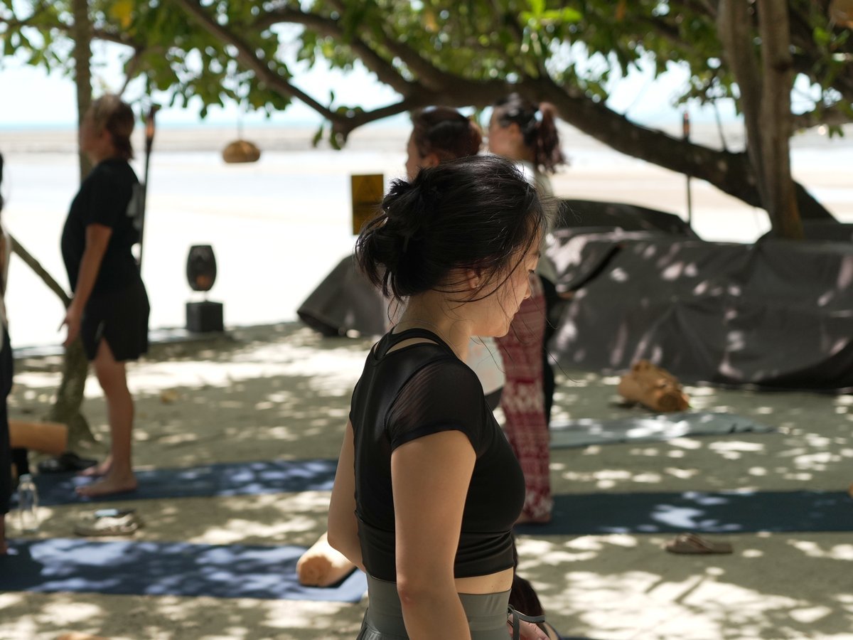Tien teaching a class by the sea